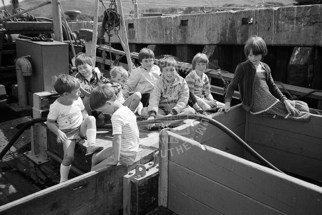 Group of children on deck of boat, Campbeltown