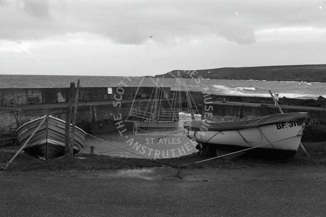 Drawn up boats at harbour, Sandend, 1985.