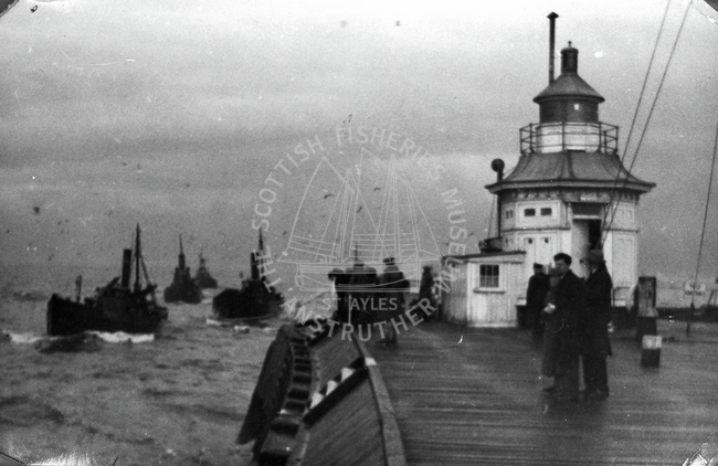 Great Yarmouth pier with boats entering the