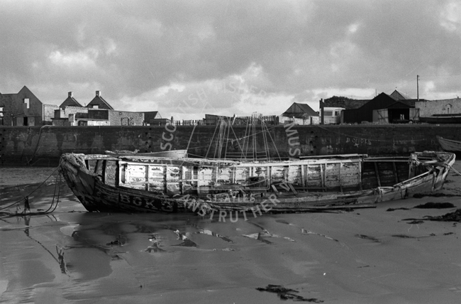 Wrecked vessel in disused harbour, Port Gordon