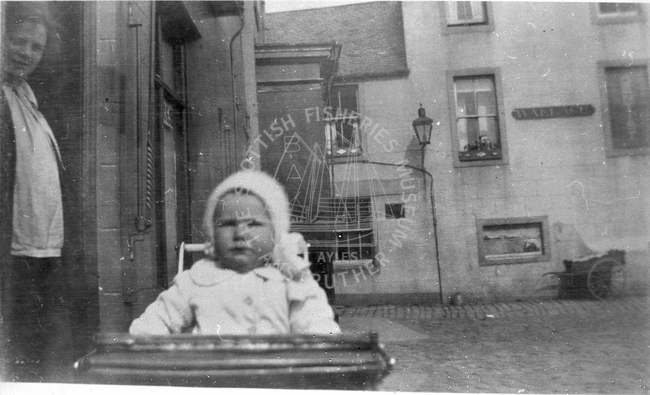 Baby portrait at street, Anstruther. 
