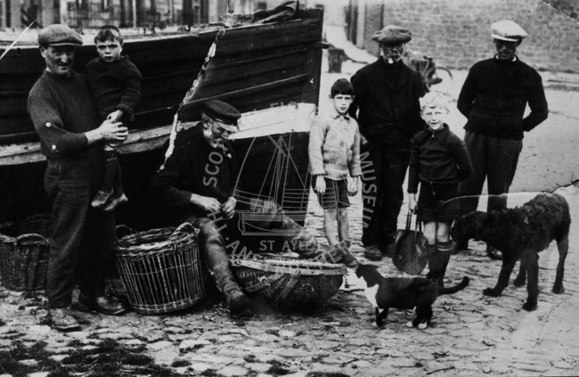 Fishermen and children at Dunbar, c.1927-1930.