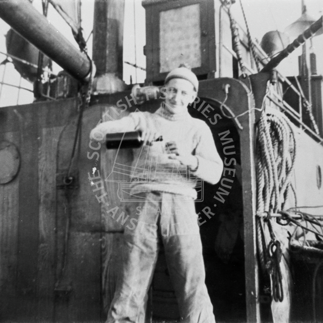 J. Taylor issuing the rum ration aboard 'Brighter
