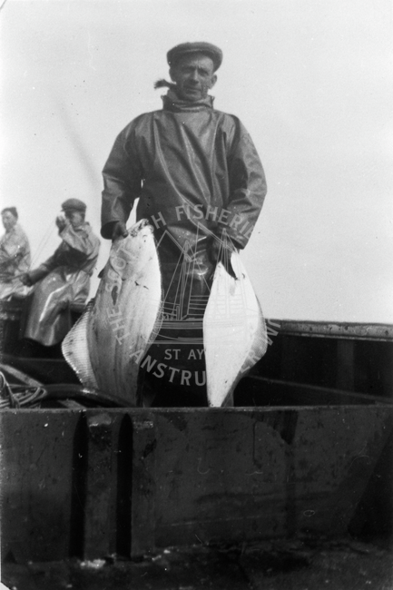 Martin Butters with two halibut aboard 'Brighter