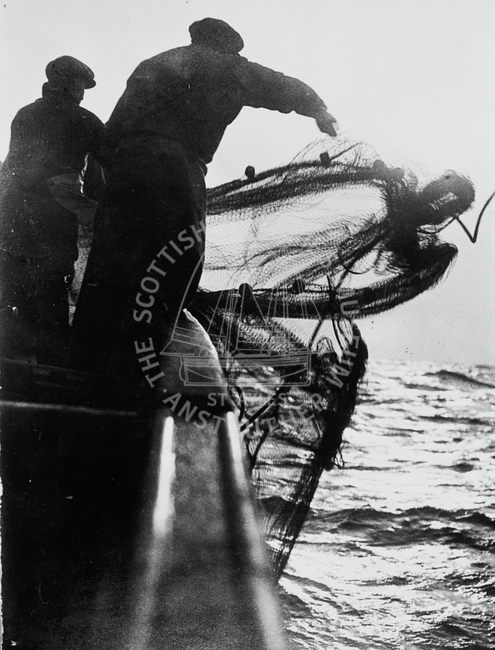 Fishermen shooting the nets