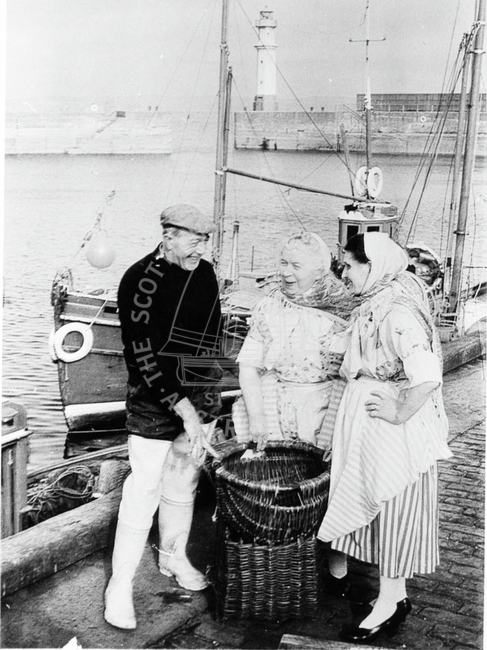 Newhaven Fisherfolk posing by baskets