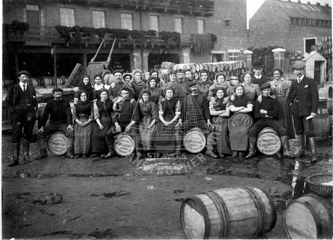 Fish yard Workers posed on barrels, Great Yarmouth