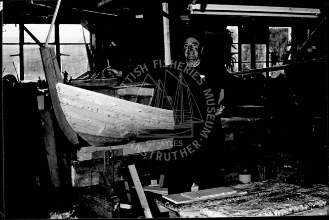 Gilbert Clark in a boatshed